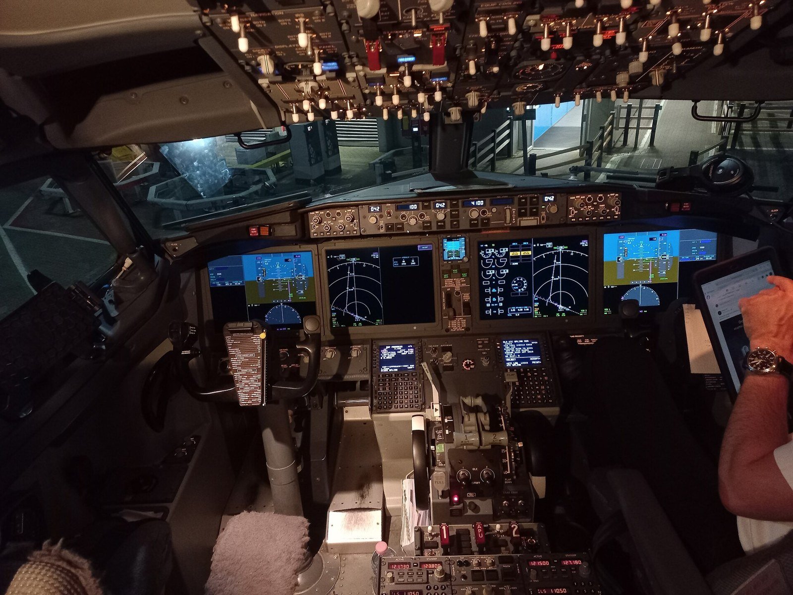 The flight deck of a Boeing 737 MAX with its two pilot seats and instrument screens