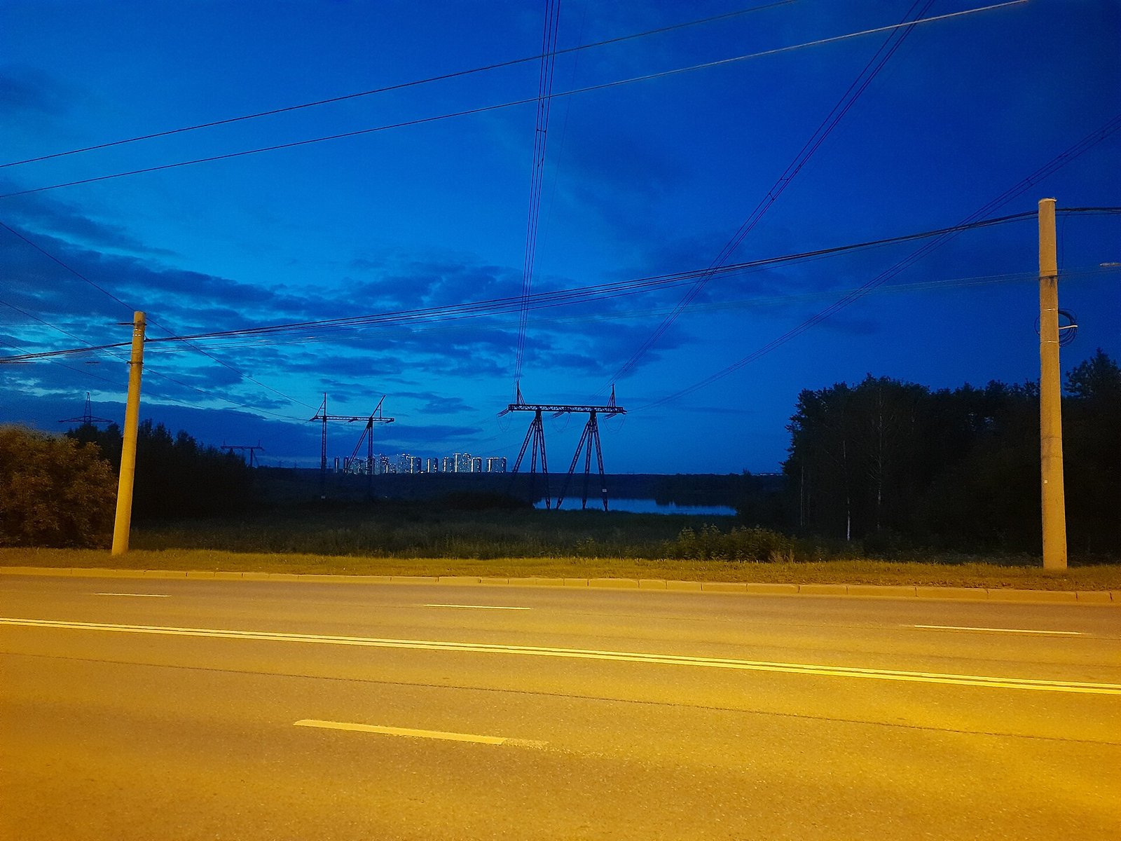 Power lines and tower blocks at dusk in the Chkalovsky district of Yekaterinburg
