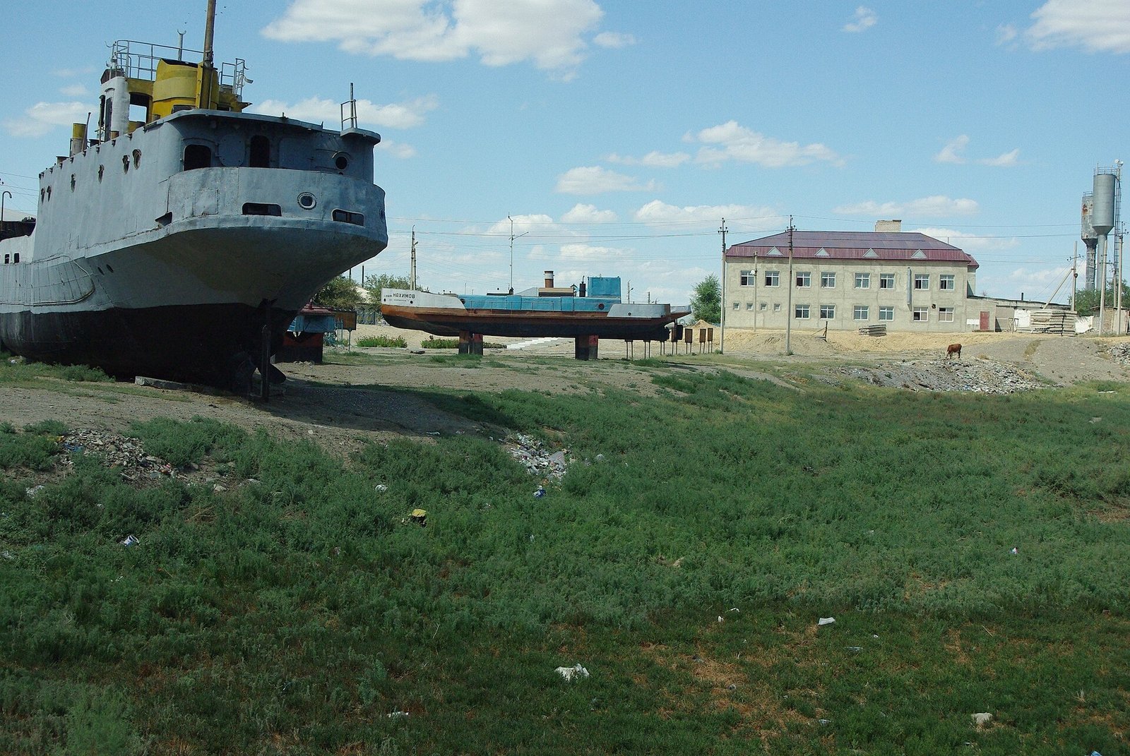 A rusting ship stranded on dry ground in the old harbour of Aral, Kazakhstan