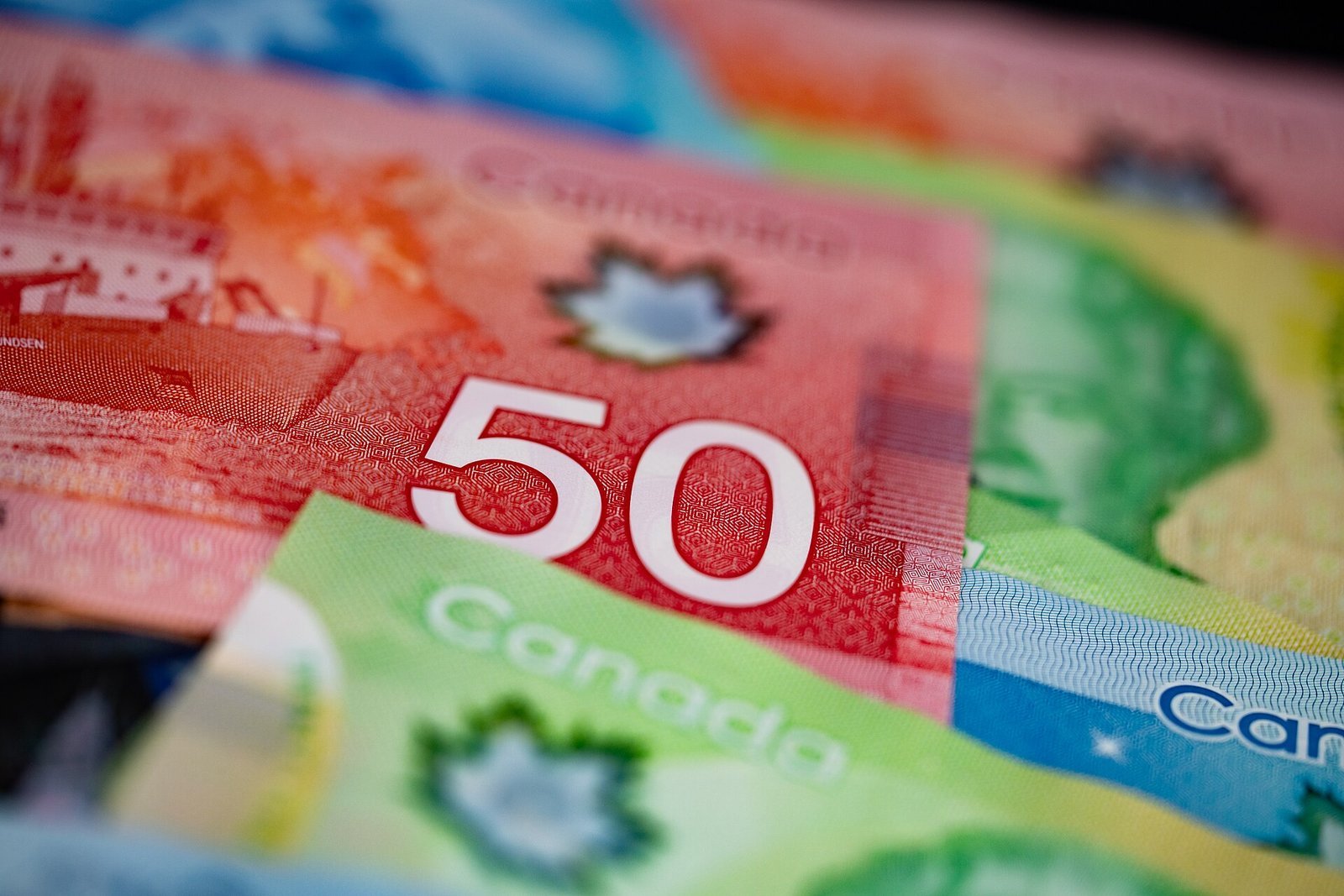Canadian banknotes fanned out in a close-up